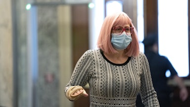 Senator Kyrsten Sinema of Arizona wears a protective mask while arriving at the Capitol on December 11. 