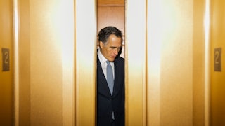 Mitt Romney departs the Senate Chamber following a vote at the U.S. Capitol.