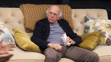 Larry David slumped on a couch in HBO’s “Curb Your Enthusiasm”