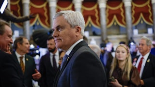 James Comer stands in profile in front of a crowd