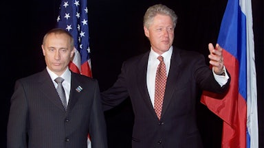 Bill Clinton and Vladimir Putin pose for a photo op
