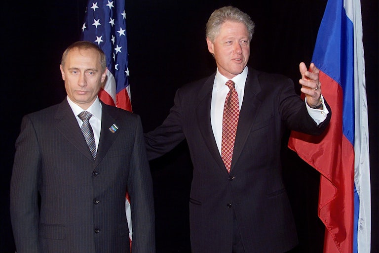 Bill Clinton and Vladimir Putin pose for a photo op