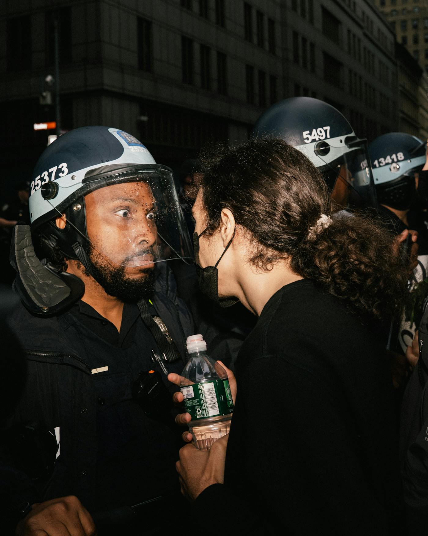 A police reacts to a protester who is in his face at s in New York City on Sunday at the No Kings event