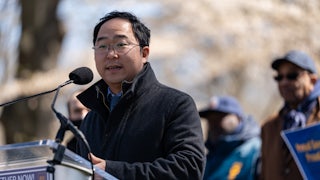 New Jersey Representative Andy Kim speaks at a lecturn outside