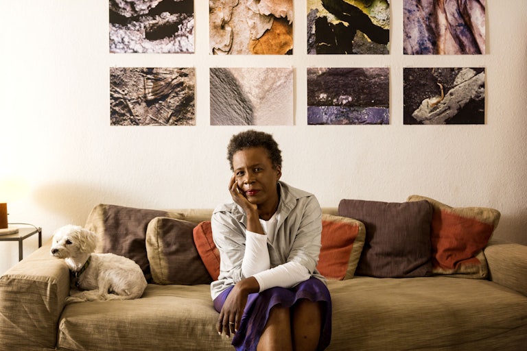 Poet Claudia Rankine and her dog at her home in September 2014.