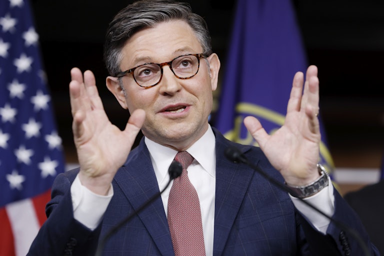 House speaker Mike Johnson makes a hand gesture while speaking to reporters