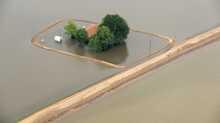 A manmade levee around a home in the Mississippi Delta 