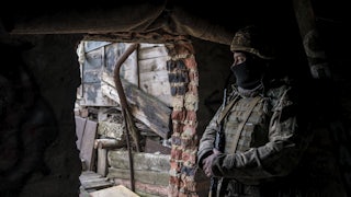 a Ukrainian soldier in a front-line position