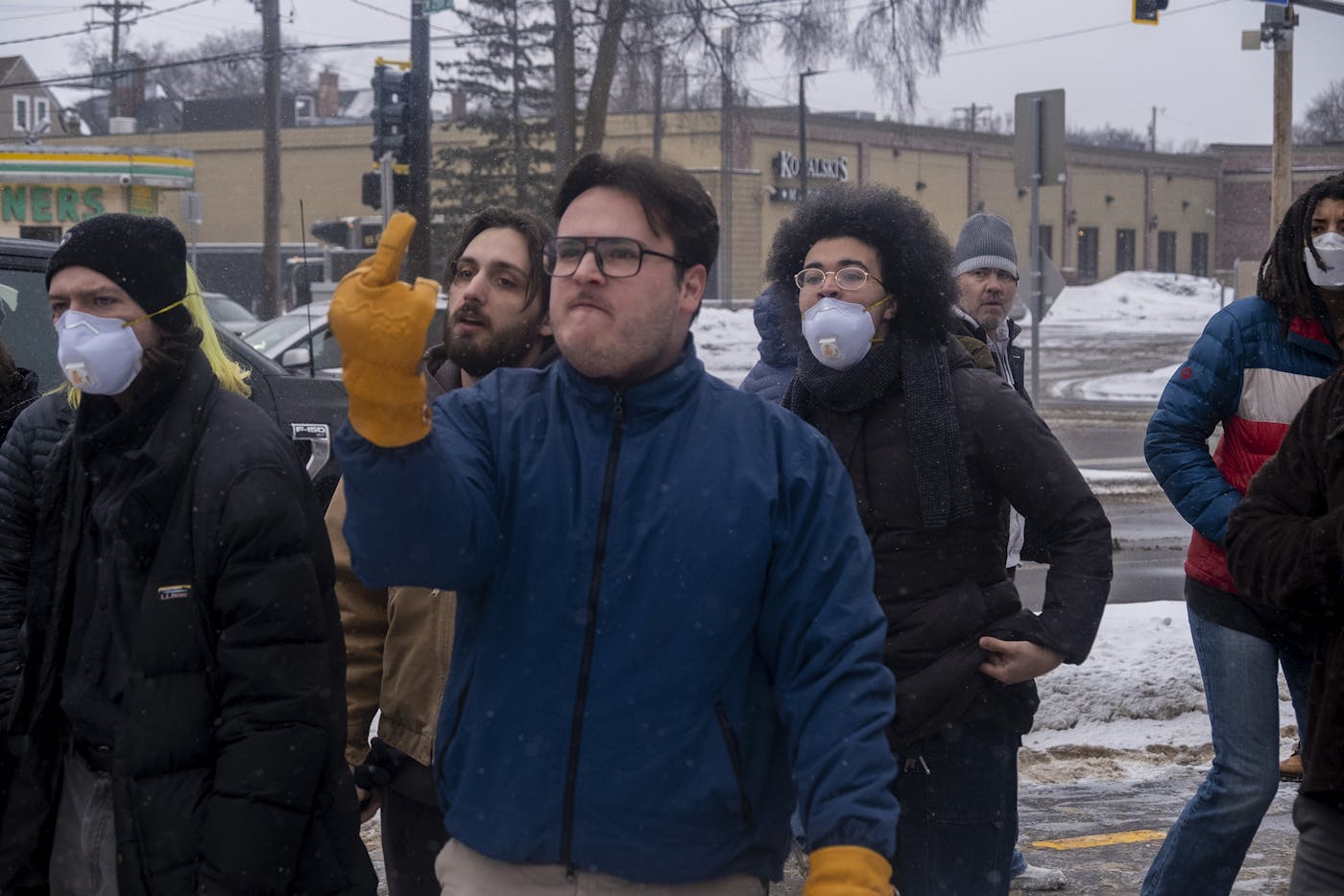 A Minneapolis resident gives Greg Bovino and his entourage of ICE agents the middle finger after they stopped for gas and pepper-sprayed the crowd that surrounded them. January 21, 2026.