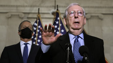 Mitch McConnell talks to reporters on Capitol Hill.