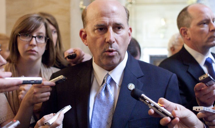 Reporter Elise Foley (left) contemplates the cold indifference of the universe during a press scrum. (AP photo)