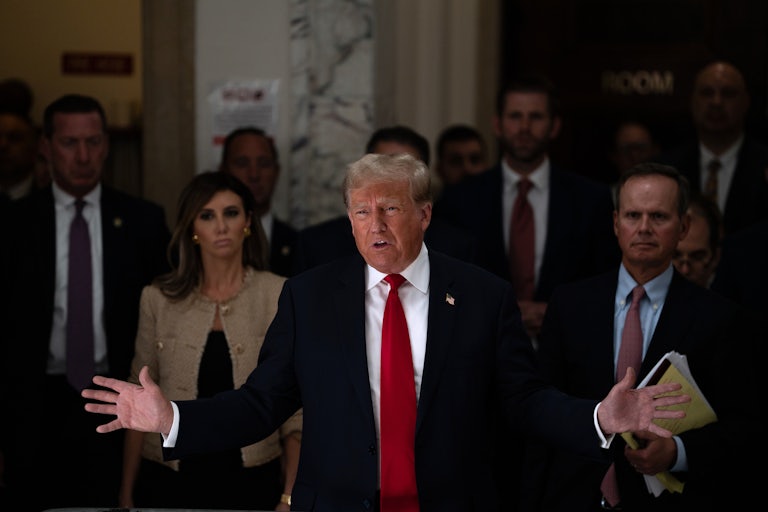 Donald Trump surrounded by his legal team