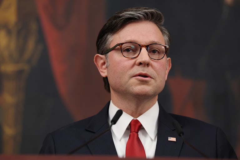 House Speaker Mike Johnson speaks at a podium during a press conference