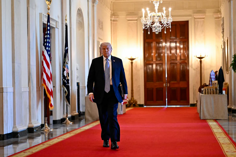 Donald Trump walking in the White House
