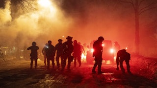 Federal agents deploy tear gas and pepper balls.