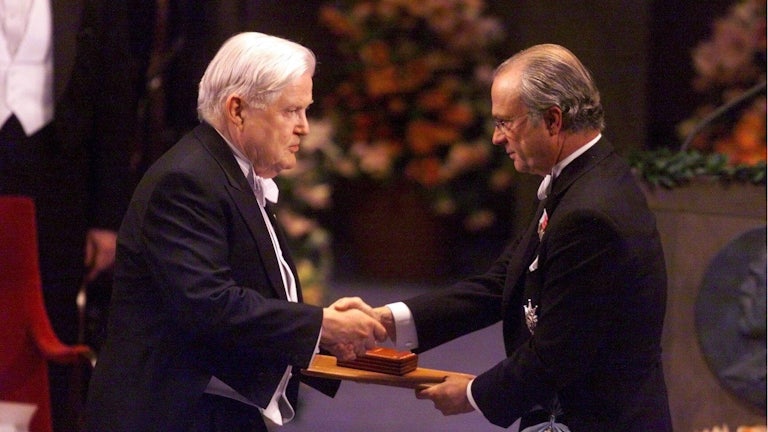 Robert Mundell receives the Nobel Prize in economics from Swedish King Carl XVI Gustaf, in 1999.