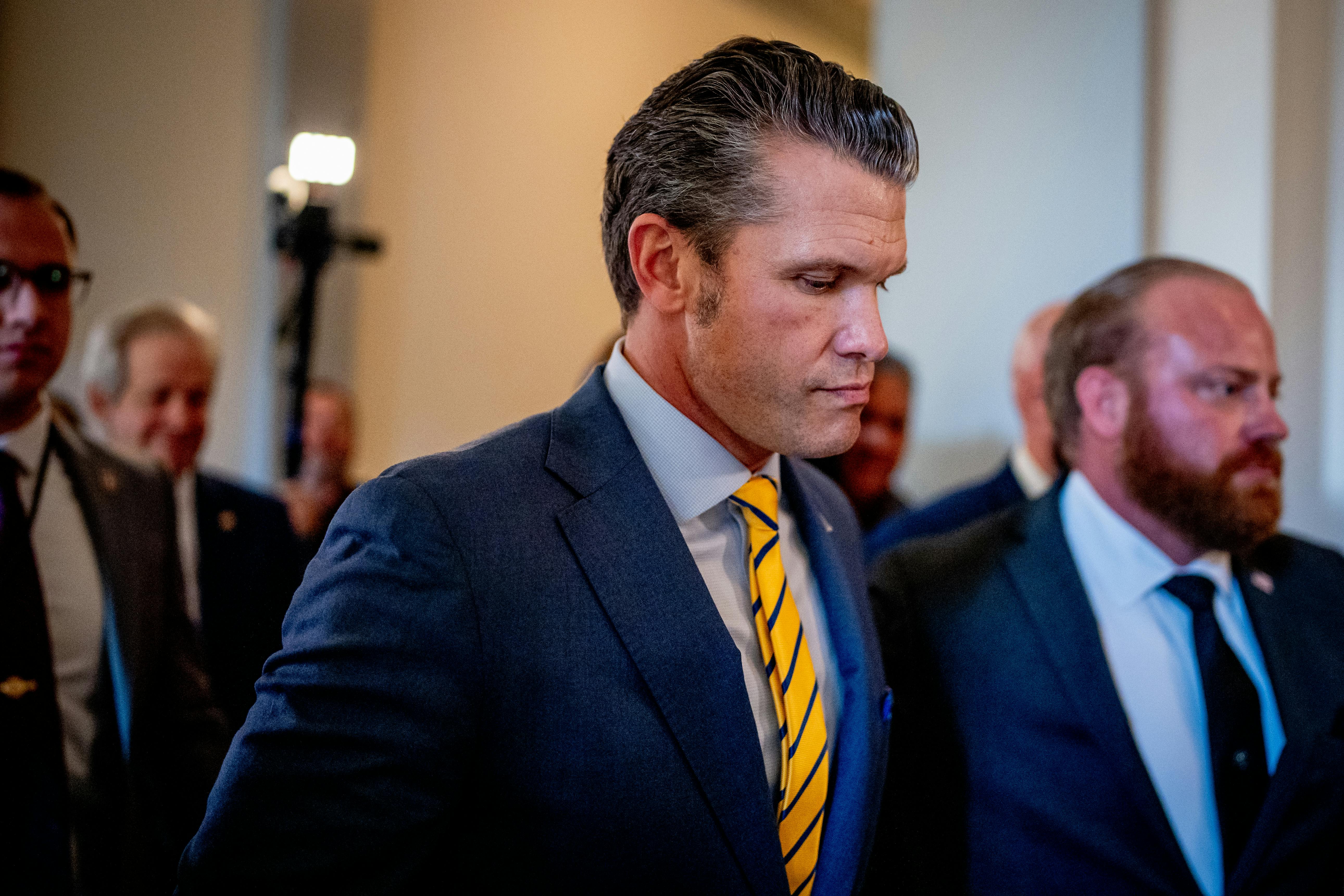Pete Hegseth looks downcast