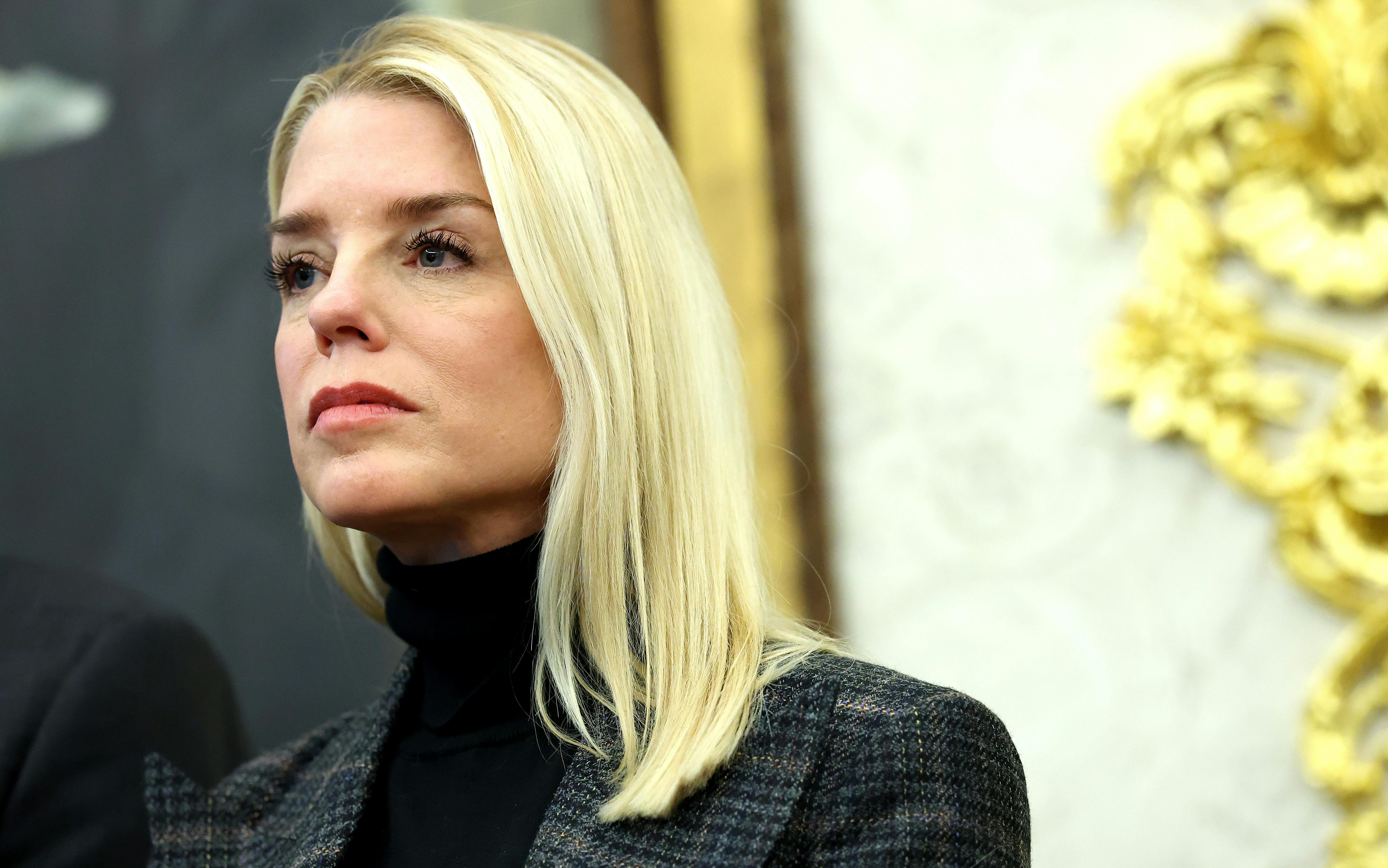 Attorney General Pam Bondi stands in the Oval Office