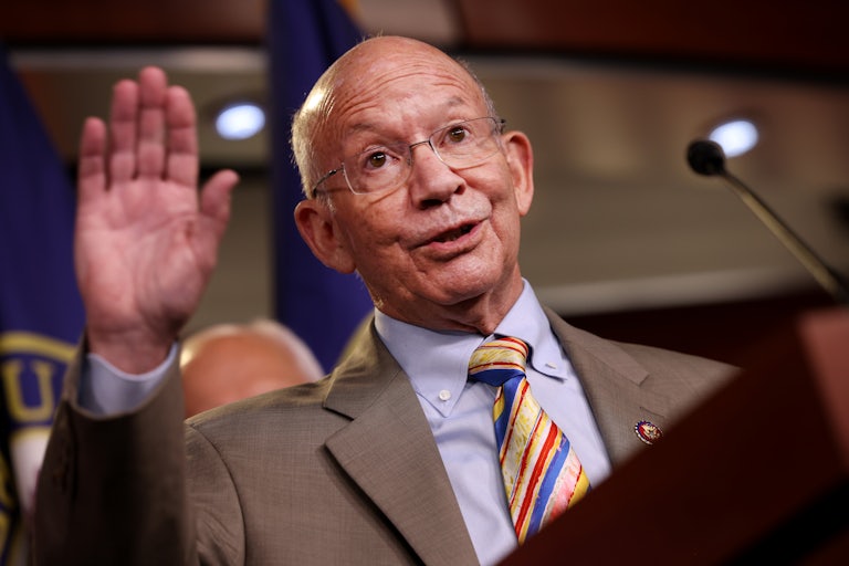 A close-up of Congressman Peter DeFazio waving.
