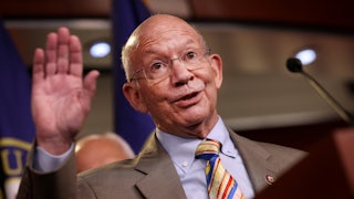 A close-up of Congressman Peter DeFazio waving.