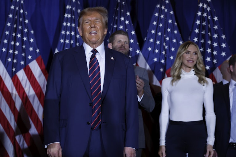 Lara Trump stands behind her father-in-law Donald Trump