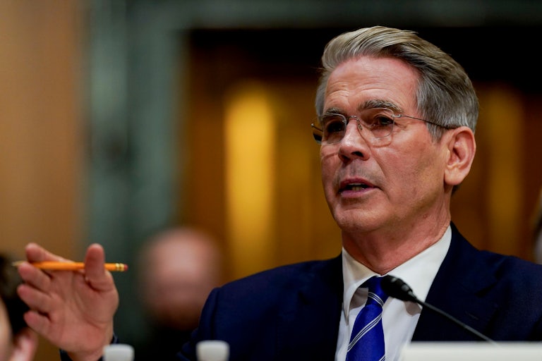 Scott Bessent gestures while speaking during his Senate confirmation hearing