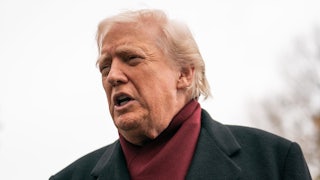 Donald Trump speaks to reporters outside the White House