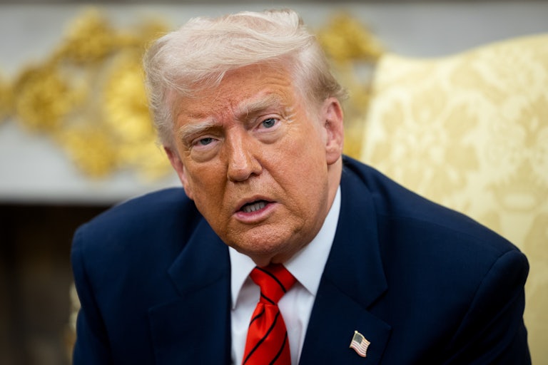 Donald Trump speaking in his gold decorated Oval Office in the White House.