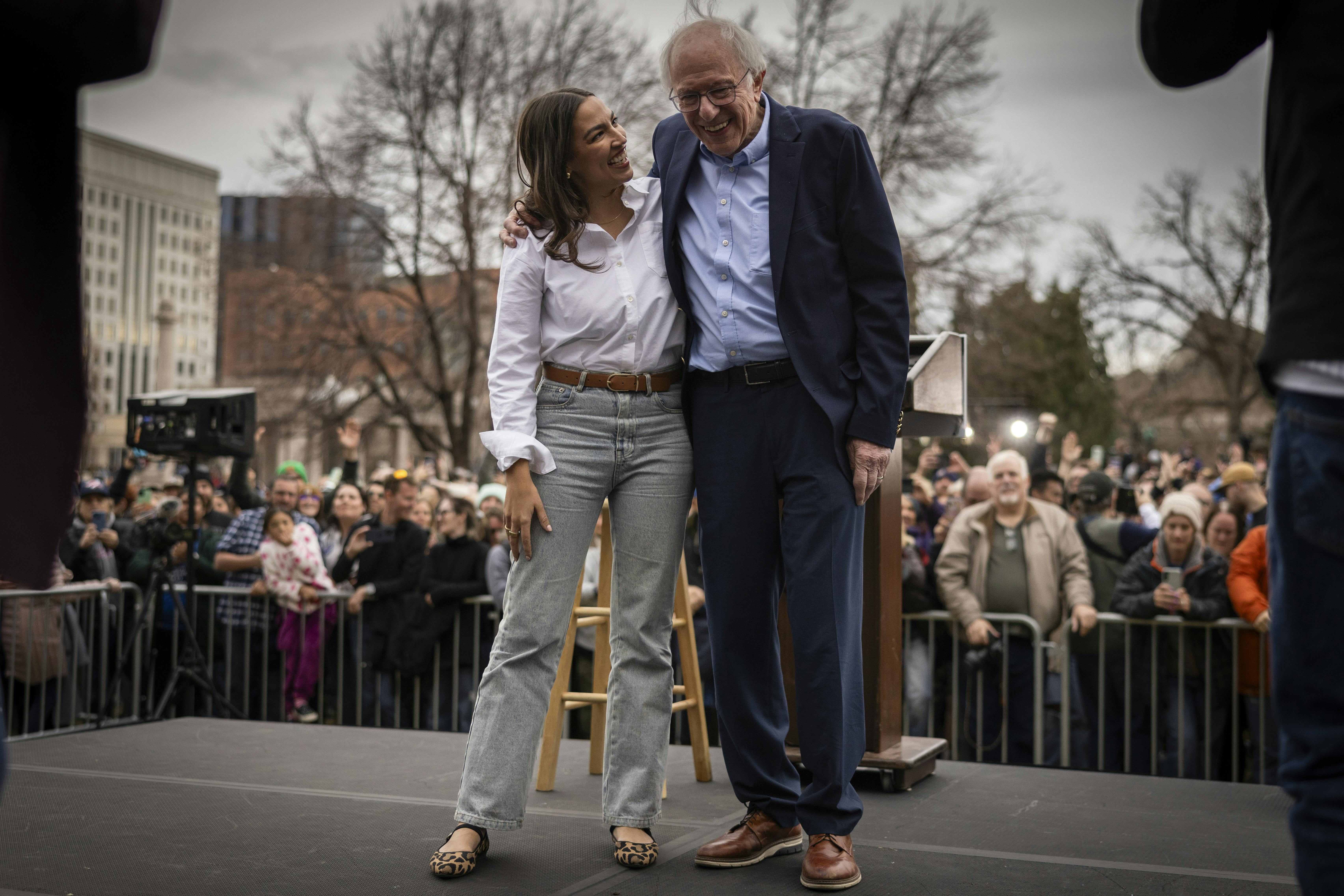 Rep. Alexandria Ocasio-Cortez and Senator Bernie Sanders during a rally 