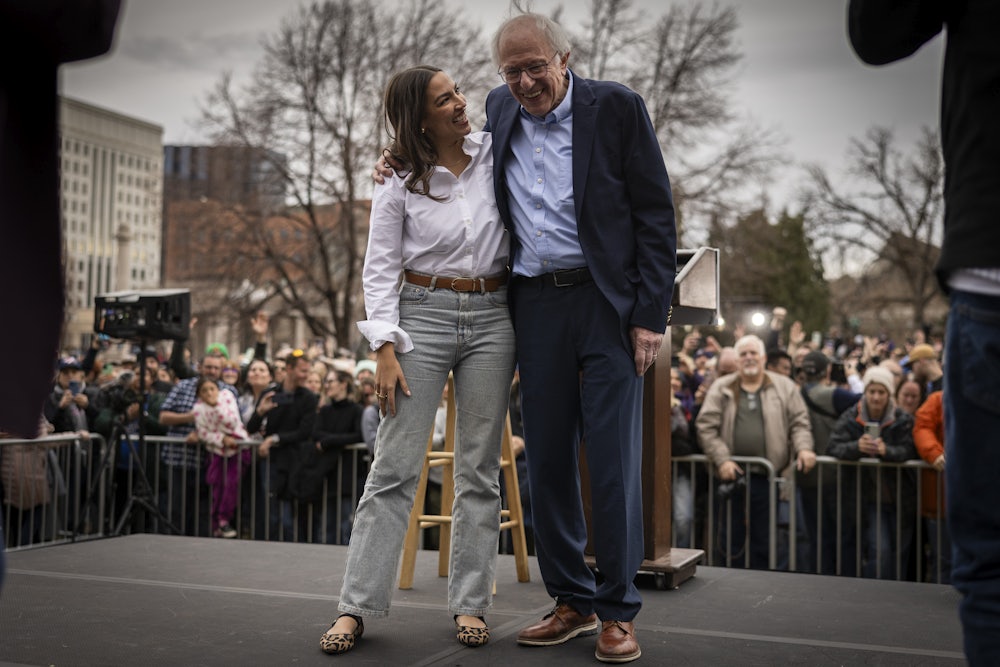 Rep. Alexandria Ocasio-Cortez and Senator Bernie Sanders during a rally