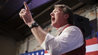 Virginia gubernatorial candidate Glenn Youngkin gestures at a rally.