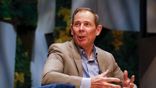 John Curtis talks while seated.