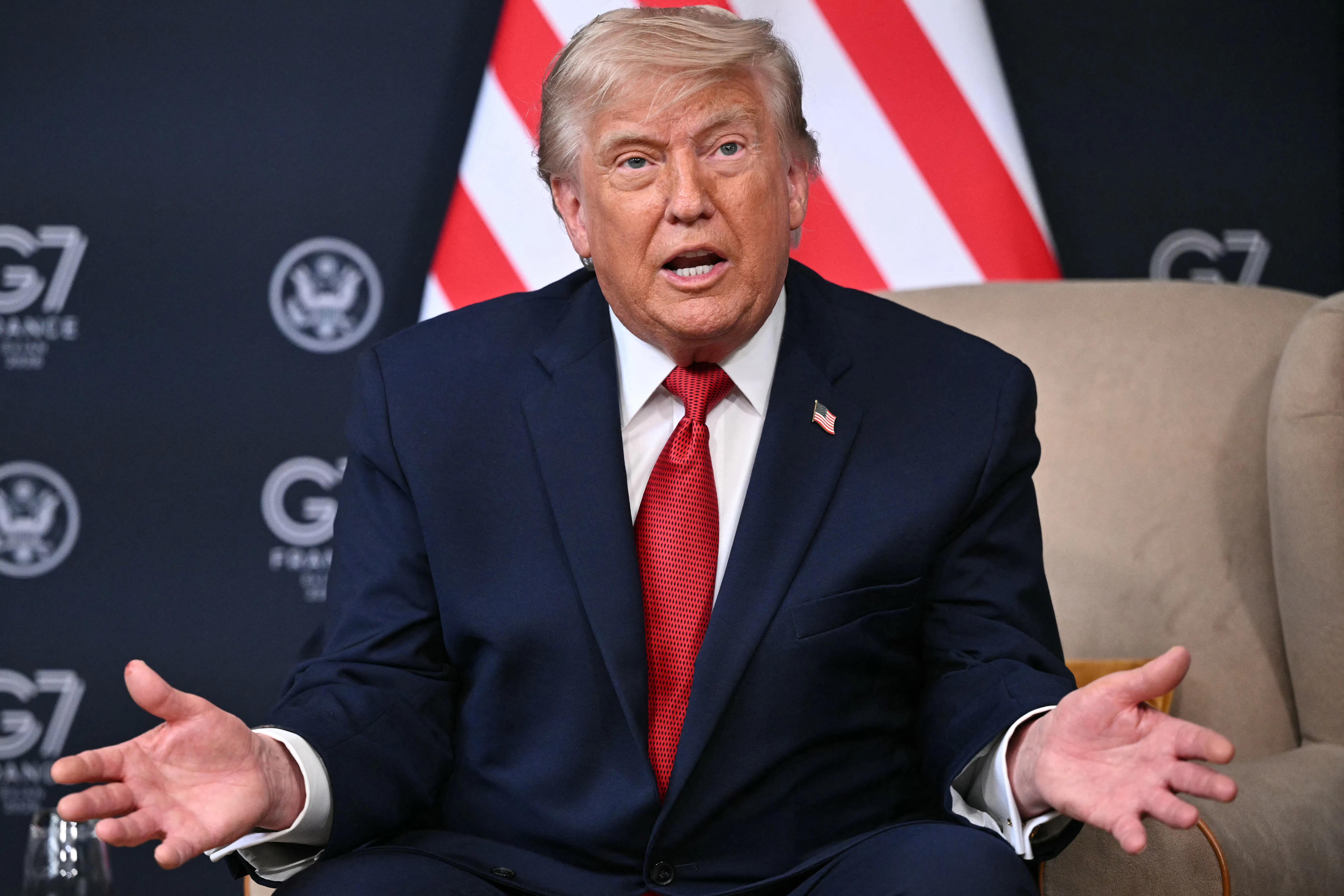 Donald Trump spreads his hands, looking puzzled