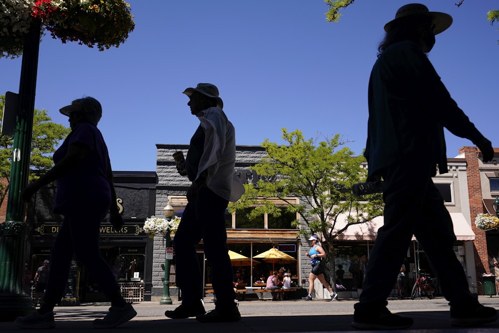 People walk on the street in Coeur d'Alene, Idaho.