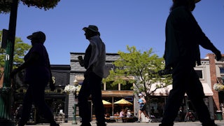 People walk on the street in Coeur d'Alene, Idaho.
