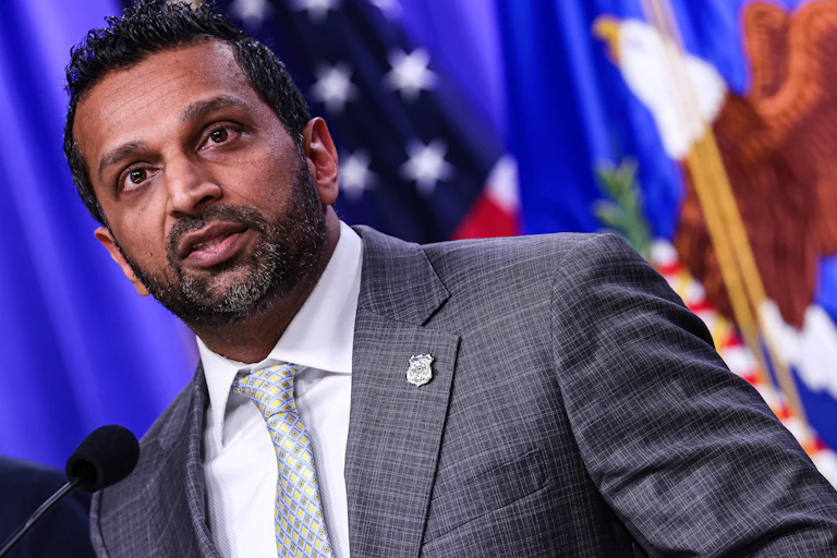 FBI Director Kash Patel speaks at a podium