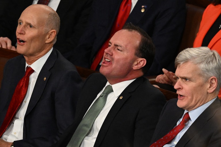 Rick Scott, Mike Lee, and Bill Cassidy sit next to each other
