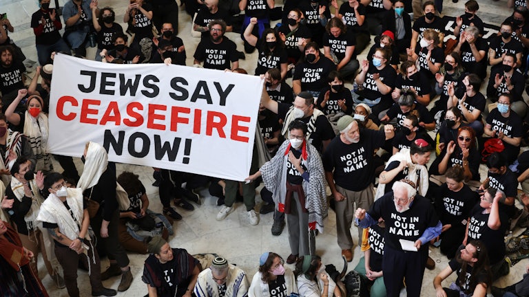 Members of Jewish Voice for Peace and IfNotNow protest in the Cannon House Office Building