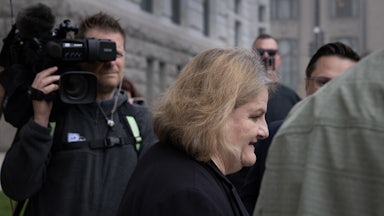 Judge Hannah Dugan is seen in profile as she walks out of the courthouse in Milwaukee, Wisconsin