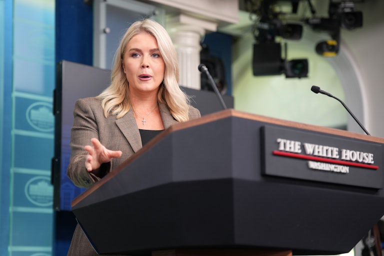 Karoline Leavitt speaks at the podium in the White House press briefing room.