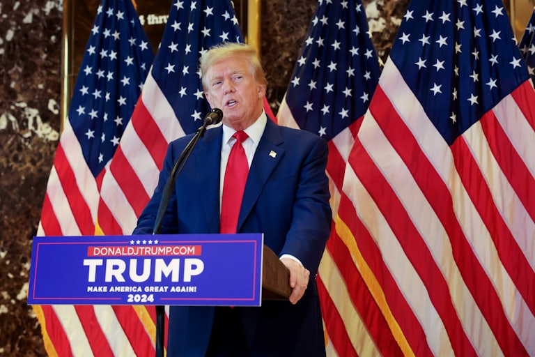 Donald Trump speaks into a microphone