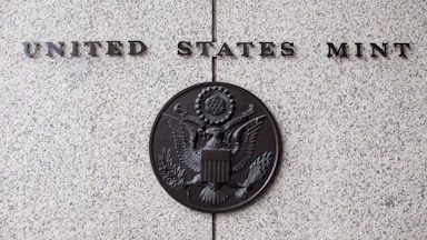 The U.S. Mint seal on the side of the building
