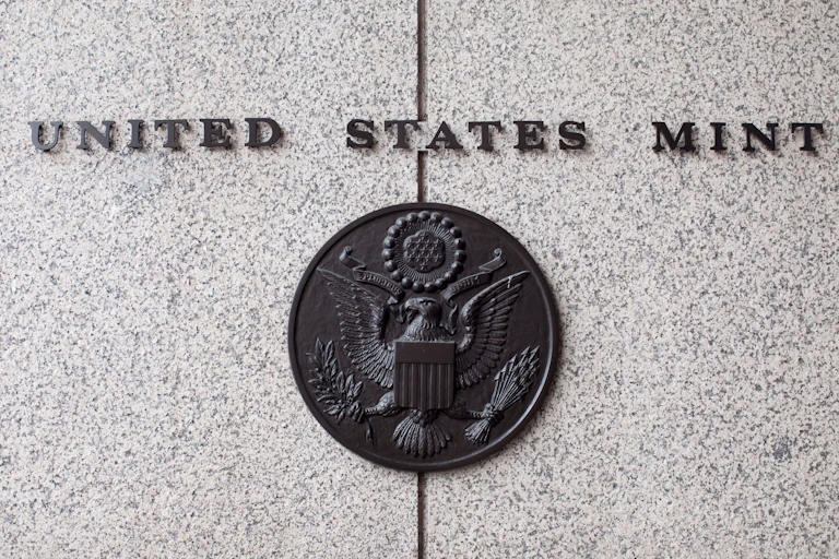 The U.S. Mint seal on the side of the building