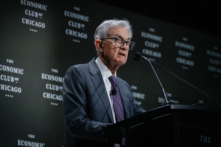 Federal Reserve Chair Jerome Powell speaks at a lectern at The Economic Club of Chicago.