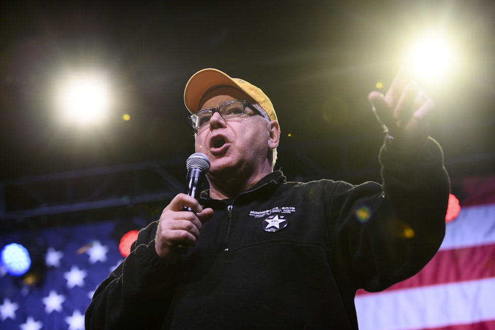 Minnesota Governor Tim Walz introduces Democratic presidential candidate Sen. Amy Klobuchar during a campaign rally in 2020.