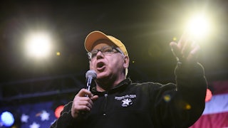 Minnesota Governor Tim Walz introduces Democratic presidential candidate Sen. Amy Klobuchar during a campaign rally in 2020.