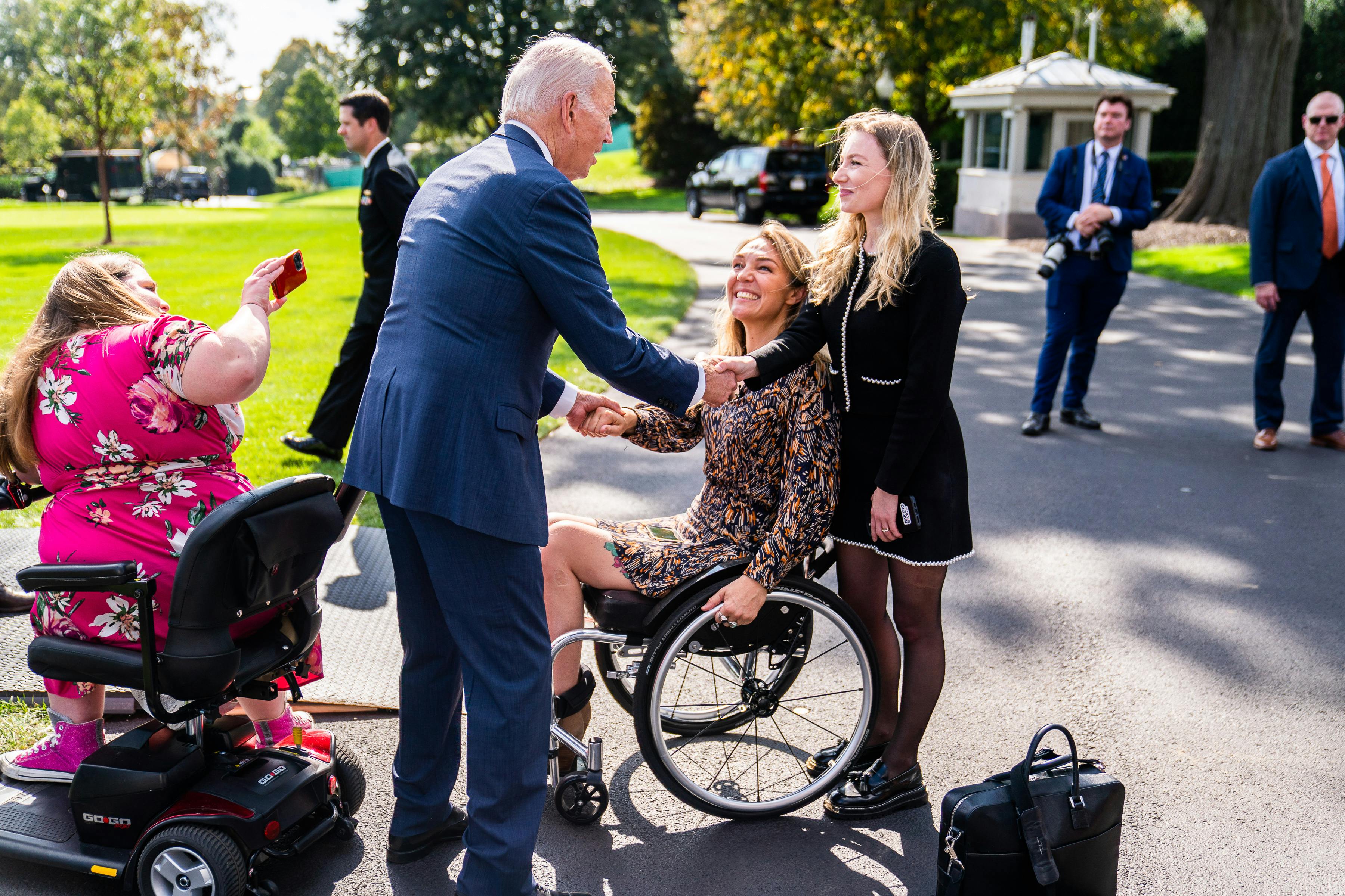 Biden greets guests during a celebration of the Americans with Disabilities Act 