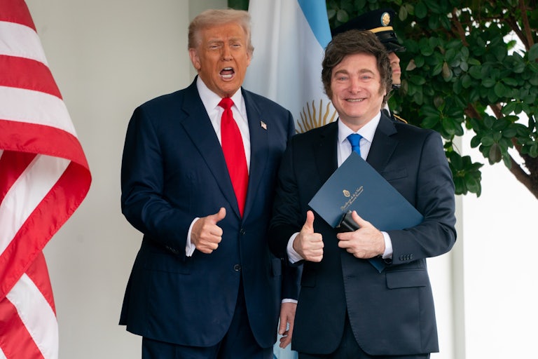Donald Trump and Argentine President Javier Milei gives thumbs-ups while standing outside the White House