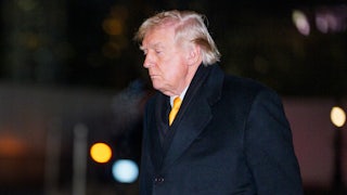 Donald Trump looks down as he walks