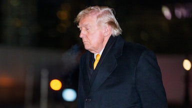 Donald Trump looks down as he walks